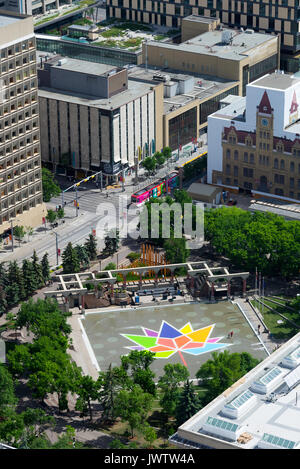 A Colourful Maple Leaf Embedded in The Olympic Plaza with a Calgary Transit Passenger Train in Calgary Alberta Canada from The Calgary Tower Stock Photo