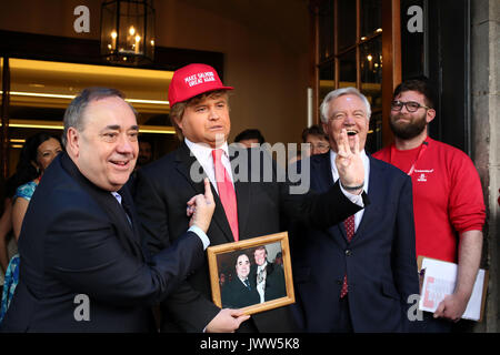 Edinburgh, Scotland, UK. 13th Aug, 2017. 'Donald Trump' (Danny Posthill, Impressionist) centre meets (left) Alex Salmond Former SNP leader and (in suit) David Davis MP Secretary of State for Exiting the European Union the first guest on the Edinburgh Festival Fringe Show 'Alex Salmond' Unleashed' pictured outside the Assembly Rooms, Edinburgh Credit: Allan Milligan/Alamy Live News Stock Photo