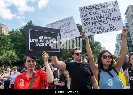 New York, NY, USA. 13th Aug, 2017. New Yorkers gathered in Union Square to stand in solidarity with the people of Charlottesville, VA, condemn the Alt Right, fascism, and President Donald Trump, after three people were killed in connection with a right wing rally called 'Unite the right.' The crowd included activists from Democratic Socialists, Black Lives Matter, the ACLU and other groups. CREDIT: Credit: Stacy Walsh Rosenstock/Alamy Live News