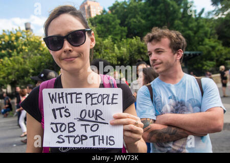 New York, NY, USA. 13th Aug, 2017. New Yorkers gathered in Union Square to stand in solidarity with the people of Charlottesville, VA, condemn the Alt Right, fascism, and President Donald Trump, after three people were killed in connection with a right wing rally called 'Unite the right.' The crowd included activists from Democratic Socialists, Black Lives Matter, the ACLU and other groups. CREDIT: Credit: Stacy Walsh Rosenstock/Alamy Live News