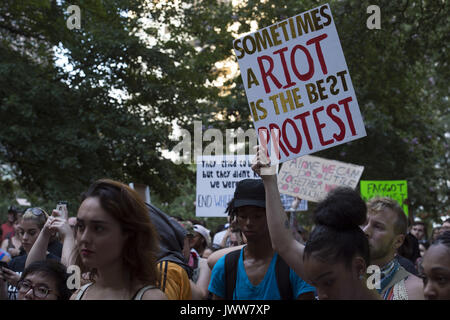 Atlanta, GA, USA. 13th Aug, 2017. Anti-Fascist protestors gather in downtown Atlanta and march along Peachtree Street, showing their support of those who demonstrated against white supremacist group in Charlottesville, VA. Rally organized by Antifa, an organization nationally that fights fascism. Credit: Robin Rayne Nelson/ZUMA Wire/Alamy Live News Stock Photo