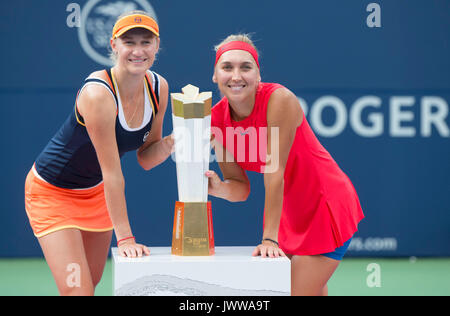 Toronto, Canada. 13th Aug, 2017. Ekaterina Makarova (L)/Elena Vesnina of Russia pose during the awarding ceremony after the final match of women's doubles against Anna-Lena Groenefeld of Germany and Kveta Peschke of the Czech Republic at the 2017 Rogers Cup in Toronto, Canada, Aug. 13, 2017. Ekaterina Makarova/Elena Vesnina won 2-0 and claimed the title. Credit: Zou Zheng/Xinhua/Alamy Live News Stock Photo