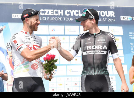 Dolany, Czech Republic. 13th Aug, 2017. Italian cyclist Filippo Fortin (left, Tirol Cycling Team), best Czech racer of the race, and Irish cyclist Sam Bennett (right, team Bora Hansgrohe), absolute winner of the race, are seen after fourth and final stage of the Czech Cycling Tour in Dolany, Czech Republic, on August 13, 2017. Credit: Ludek Perina/CTK Photo/Alamy Live News Stock Photo