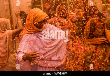 Beijing, China. 21st Mar, 2016. File photo taken on March 21, 2016 shows women throwing petals of calendula during a pre-celebration of Holi festival held in Vrindavan, northern India. Credit: Bi Xiaoyang/Xinhua/Alamy Live News Stock Photo