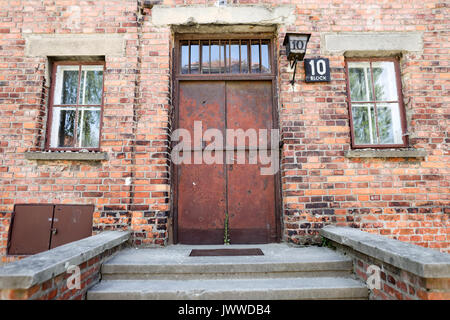 The entrance door to Block 10 in the former Auschwitz concentration camp in Oswiecim, Poland, 26 June 2017. Executions have taken place at the 'Black Wall' in the yard between Block 10 and 11 until December 1943. The major paramilitary organization in Nazi Germany, SS (Schutzstaffel, lit. 'Protection Squadron') ran the concentration and death camp between 1940 and 1945. Approximately 1.1 to 1.5 million people, most of them Jewish, have been killed in the camp and its satellites. Auschwitz stands as the symbol for the industrialized mass murder and the holocaust of Nazi Germany. Who was not kil Stock Photo
