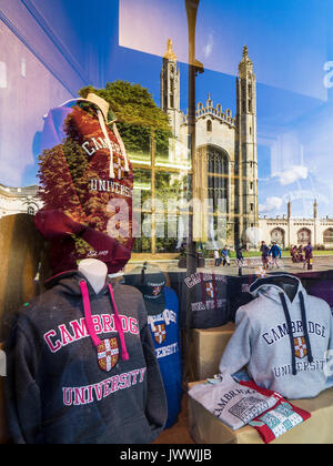 Kings College Chapel - the famous c15th Kings College Chapel is reflected in the window of shops in Kings Parade selling gifts and clothing. Stock Photo