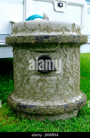 Grass covered Aquaroll connected to a caravan. UK Stock Photo