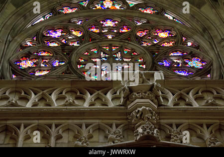 PRAGUE - APRIL 13: Interior with stained-glass window of gothic St. Vitus cathedral in Prague Castle, on April 13, 2013 in Prague, Czech Republic Stock Photo