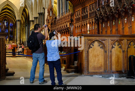 Tourists photographing the interior of Salisbury Cathedral,Wiltshire,UK Stock Photo