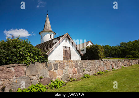 Medieval white washed church in Bollerup, Sweden. Stock Photo