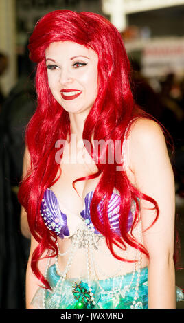 Young woman dressed as Ariel from Walt Disney's The Little Mermaid film at the London Film & Comic Con 2017 (Press pass/permission obtained). Stock Photo