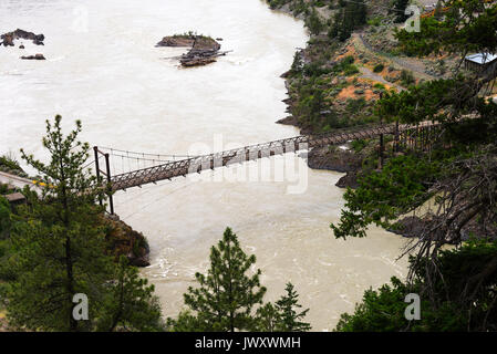 A Narrow Wooden Floored Road Bridge over the Fraser River near Lillooet British Columbia Canada Stock Photo