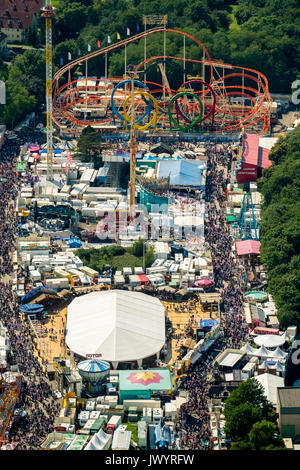 582. Cranger fair, fairground carousel, roller coaster, Ferris wheel, observation tower, rides, fair attractions, festival, audience chains karussel,  Stock Photo