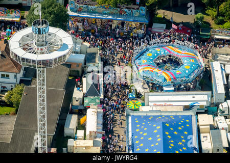 582. Cranger fair, fairground carousel, roller coaster, Ferris wheel, observation tower, rides, fair attractions, festival, audience chains karussel,  Stock Photo