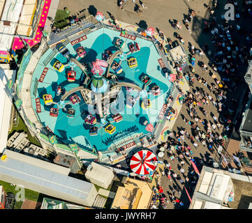 582. Cranger fair, fairground carousel, roller coaster, Ferris wheel, observation tower, rides, fair attractions, festival, audience chains karussel,  Stock Photo