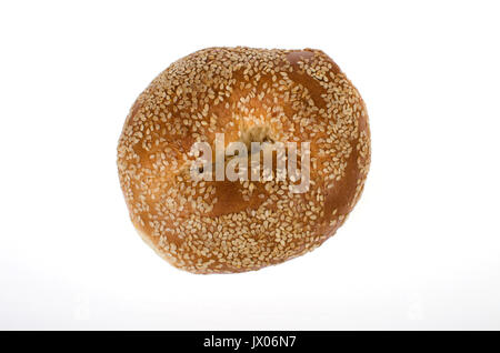 Single Sesame seed bagel on white background, cut out. Stock Photo