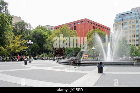 New York, USA - 27 September 2016: People enjoying Washington Square Park. Washington Square Park is a 9.75-acre public park in the Greenwich Village  Stock Photo