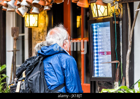 Quebec City, Canada - May 30, 2017: Lower old town street called Rue du Petit Champlain with older couple looking at menu of restaurant closeup Stock Photo