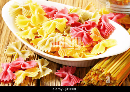 Flavored and colored bow tie pasta Stock Photo