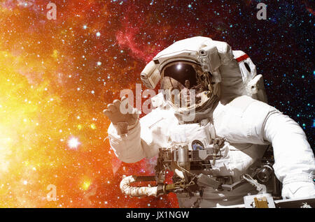 Astronaut in outer space against the backdrop of the outer space. Stock Photo