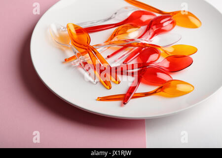 Spoons on white plate, food concept Stock Photo