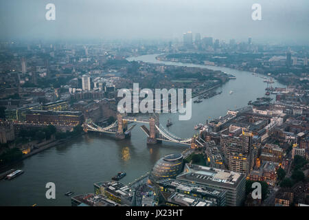 View of River Thames towards Canary Wharf, open Tower Bridge with London City Hall, twilight, aerial view, London, England Stock Photo