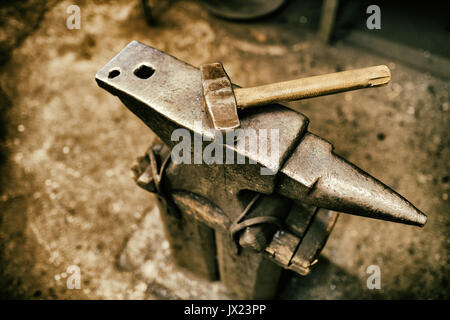 Blacksmith tools in workshop different pliers and hammers Stock Photo