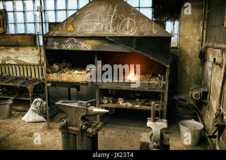 Blacksmith tools in workshop different pliers and hammers Stock Photo