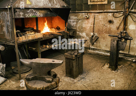 Blacksmith tools in workshop different pliers and hammers Stock Photo