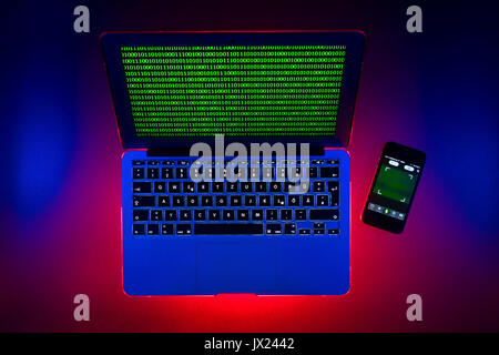Laptop, symbolic image, cybercrime, computer crime, computer hacker, data security, smartphone tracking Stock Photo