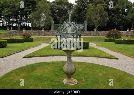 the gardens at prideaux place padstow uk in summer with green gardens and fountains and statuary formally gardening grounds kept weel by gardeners Stock Photo