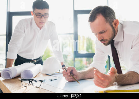 professional architects in formal wear working at modern office Stock Photo