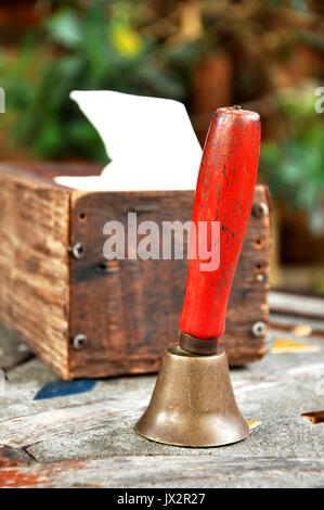 A handbell is a bell designed to be rung by hand. Stock Photo