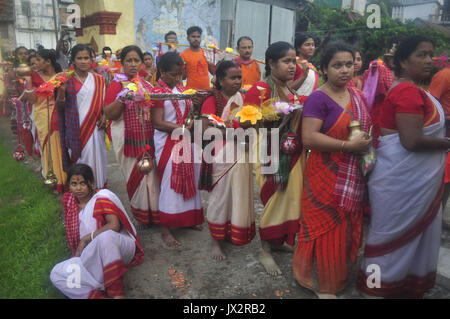 Agartala, India. 14th Aug, 2017. Devotees participate in the Kanwar Yatra pilgrimage on the occasion of Sawan festival in Agartalar, in the northeastern state of Tripura. Credit: Abhisek Saha/Pacific Press/Alamy Live News Stock Photo