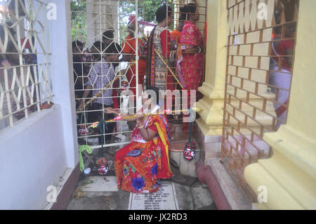 Agartala, India. 14th Aug, 2017. Devotees participate in the Kanwar Yatra pilgrimage on the occasion of Sawan festival in Agartalar, in the northeastern state of Tripura. Credit: Abhisek Saha/Pacific Press/Alamy Live News Stock Photo