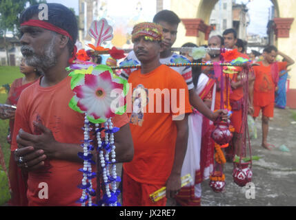 Agartala, India. 14th Aug, 2017. Devotees participate in the Kanwar Yatra pilgrimage on the occasion of Sawan festival in Agartalar, in the northeastern state of Tripura. Credit: Abhisek Saha/Pacific Press/Alamy Live News Stock Photo