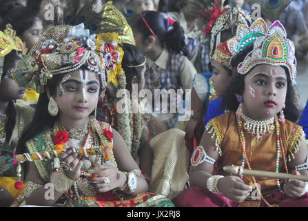 Agartala, India. 14th Aug, 2017. Indian school children dressed as Lord Krishna for a competition during Janmashtami celebration at a school in Agartala, the capital of northeastern state of Tripura. Krishna Janmashtami also known as Gokulashtami, is an annual Hindu festival that celebrates the birth of Krishna, the eighth avatar of Lord Vishnu. Credit: Abhisek Saha/Pacific Press/Alamy Live News Stock Photo