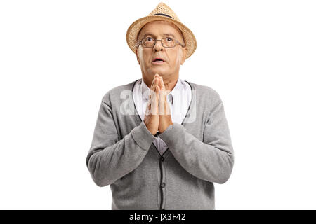 Mature man praying isolated on white background Stock Photo