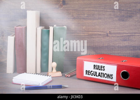 Rules And Regulations. Binder on desk in the office. Business background. Stock Photo
