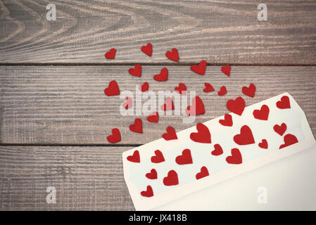 Opened envelope and many felt hearts Stock Photo