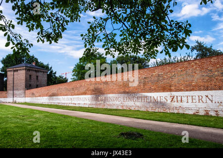 Berlin, Moabit Geschichtspark.Historic prison park on site of the former Zellengefängnis (Cell Prison)Wall with line from sonnet,In Fesseln,In Fetters Stock Photo