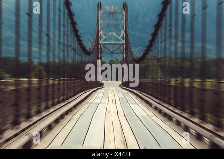 The movement on the wooden bridge by car view from the window of the cab car. Bridge in motion Stock Photo