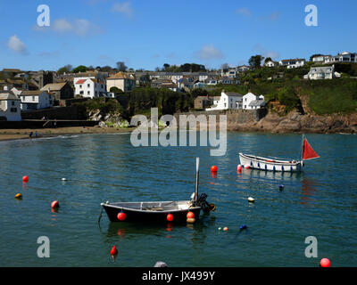 Fishing boats moored off the beach at Gorran Haven, Cornwall. Stock Photo