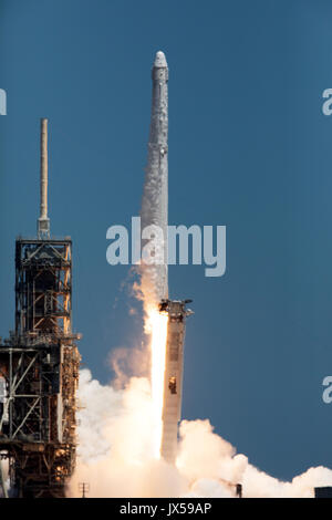 Cape Canaveral, Florida, USA. 14th August, 2017.  The SpaceX Falcon 9 rocket with the Dragon spacecraft onboard blasts off from Launch Complex 39A at the Kennedy Space Center August 14, 2017 in Cape Canaveral, Florida. Dragon is on the 12th resupply mission using the Falcon rocket and is carrying 6,400 pounds of science research, crew supplies and hardware to the International Space Station. Credit: Planetpix/Alamy Live News Stock Photo