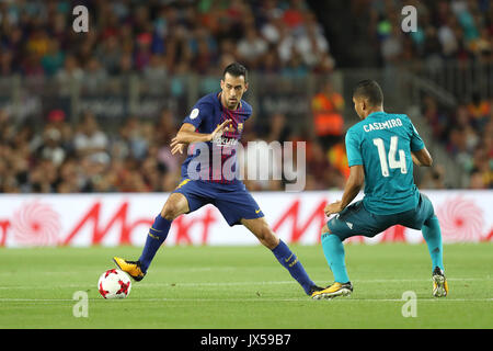 Barcelona, Spain. 13th Aug, 2017. SERGIO BUSQUETS of FC Barcelona controls the ball under pressure from CASEMIRO of Real Madrid during the Spanish Super Cup football match between FC Barcelona and Real Madrid on August 13, 2017 at Camp Nou stadium in Barcelona, Spain. Credit: Manuel Blondeau/ZUMA Wire/Alamy Live News Stock Photo