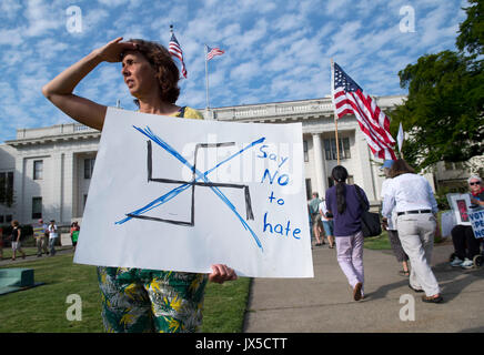 Roseburg, OREGON, USA. 14th Aug, 2017. Demonstrators march outside the Douglas County Courthouse in Roseburg in solidarity with Charlottesville, VA and against hate. About 75 people marched, chanted, and sang songs during the protest in the small town on Monday. Credit: Robin Loznak/ZUMA Wire/Alamy Live News Stock Photo