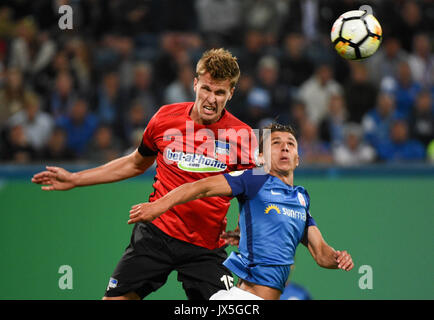 Ostsee Stadium in Rostock, Germany, 14 August 2017. Berlin's Sebastian Langkamp (L) heads the ball away next to Rostock's Soufian Benyamina during the DFB Cup match pitting Hansa Rostock vs Hertha BSC at the Ostsee Stadium in Rostock, Germany, 14 August 2017. Berlin won 2:0. Credit: dpa picture alliance/Alamy Live News Stock Photo