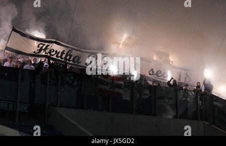 Ostsee Stadium in Rostock, Germany, 14 August 2017. Berlin supporters lighting fireworks during the DFB Cup match pitting Hansa Rostock vs Hertha BSC at the Ostsee Stadium in Rostock, Germany, 14 August 2017. The game was interrupted at minute 76 due to riots amongst spectators. Credit: dpa picture alliance/Alamy Live News Stock Photo