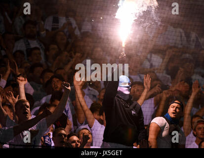 Ostsee Stadium in Rostock, Germany, 14 August 2017. Berlin supporters lighting fireworks during the DFB Cup match pitting Hansa Rostock vs Hertha BSC at the Ostsee Stadium in Rostock, Germany, 14 August 2017. The game was interrupted at minute 76 due to riots amongst spectators. Credit: dpa picture alliance/Alamy Live News Stock Photo