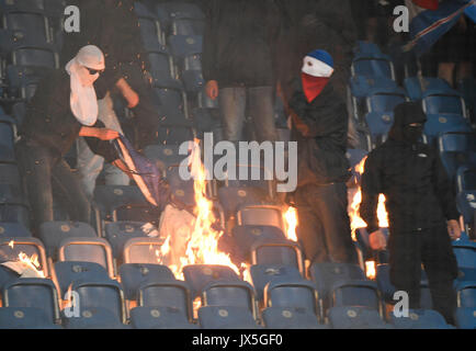 Ostsee Stadium in Rostock, Germany, 14 August 2017. Rostock hooligans set stadium seats on fire during the DFB Cup match pitting Hansa Rostock vs Hertha BSC at the Ostsee Stadium in Rostock, Germany, 14 August 2017. The game was interrupted at minute 76 due to riots amongst spectators. Credit: dpa picture alliance/Alamy Live News Stock Photo